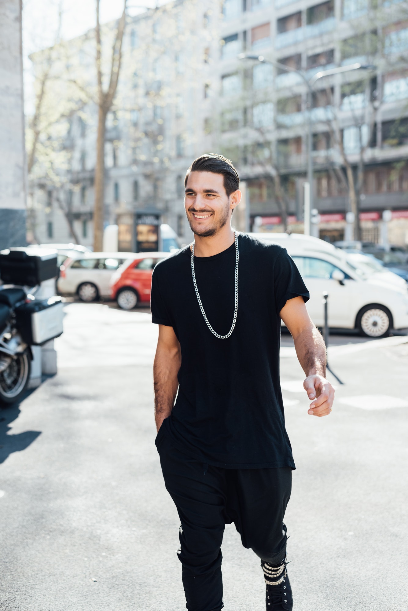 Young handsome italian boy walking in the city